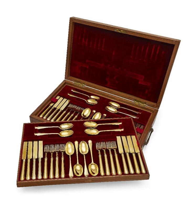 A boxed canteen of silver-gilt cutlery by Carrington & Co., London, the spoons hallmarked London, c.1920