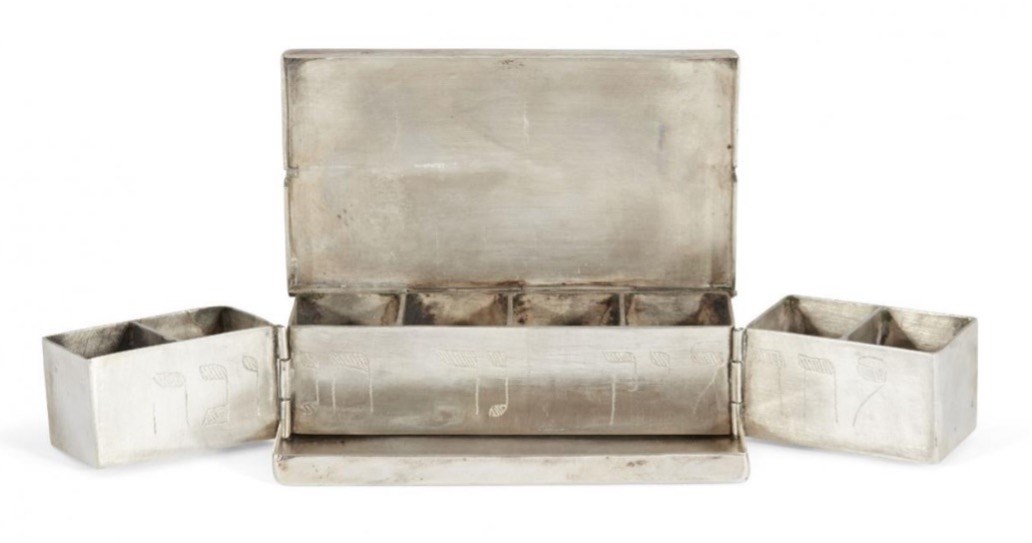  A silver travelling Hanukkah lamp in the form of a book, possibly Polish, mid-19th century