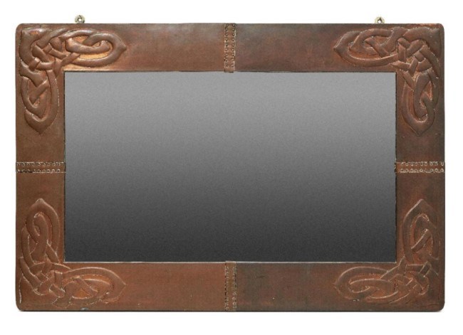   Archibald Knox (British 1864-1933), a copper wall mirror for Liberty & Co c.1900