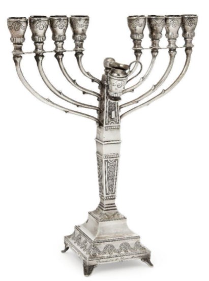 An interesting silver menorah formerly presented to Margaret Thatcher, stamped '925 sterling'