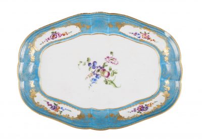 A Vincennes Sevres porcelain dish, 18th century, decorated to the centre with floral sprays, the rim with reserves of flowers within gilt tooled borders.